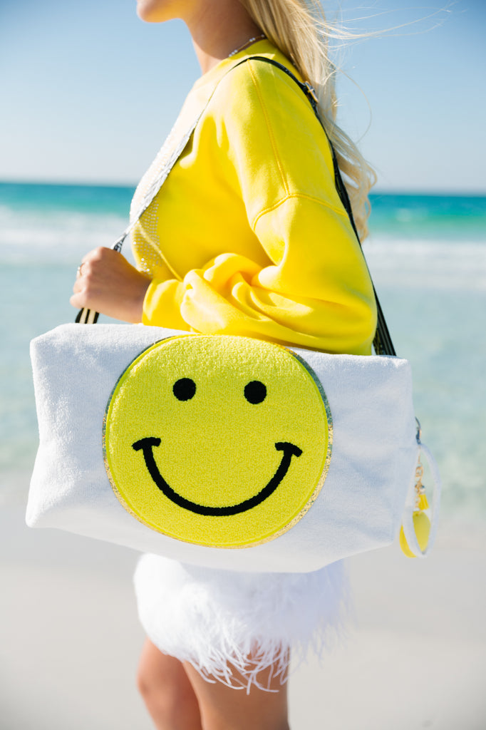 White large terry cloth bag with a yellow smiley face