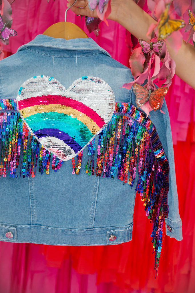 Denim jacket with multi colored sequin heart patch and multi colored sequin fringe 