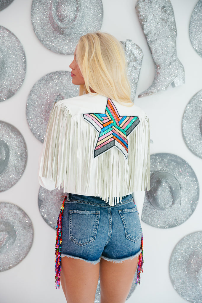 White cropped jacket with fringe and multi colored star patch