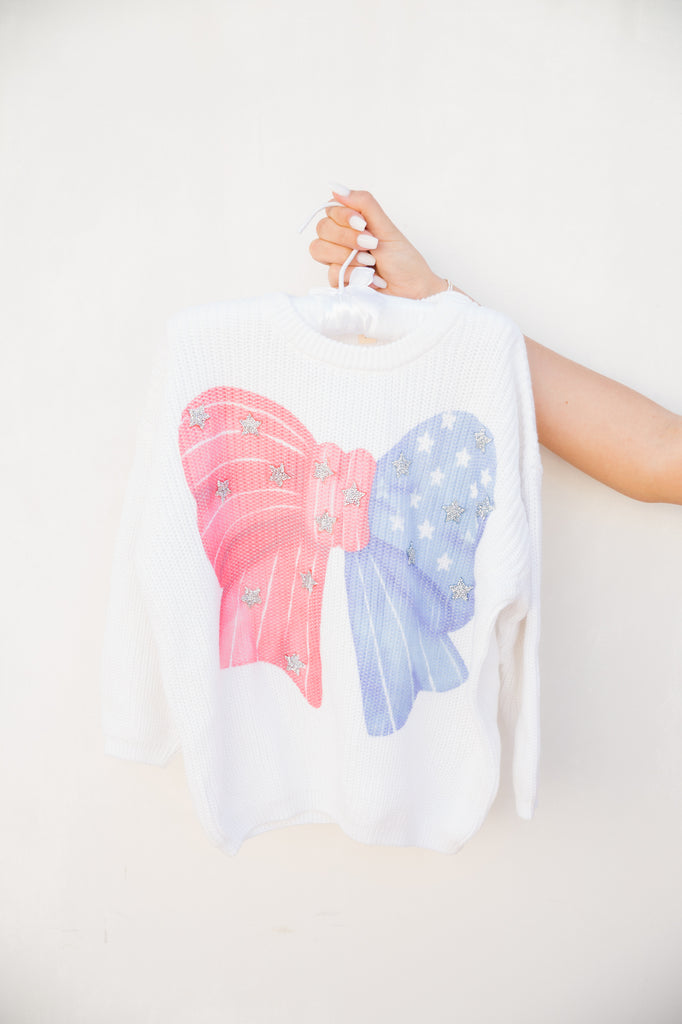 Kids white waffle sweater with an American bow print with silver stars