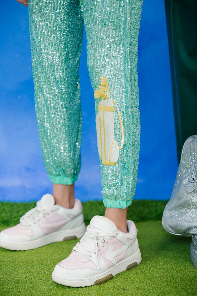 Teal sequin joggers with golf patch. 