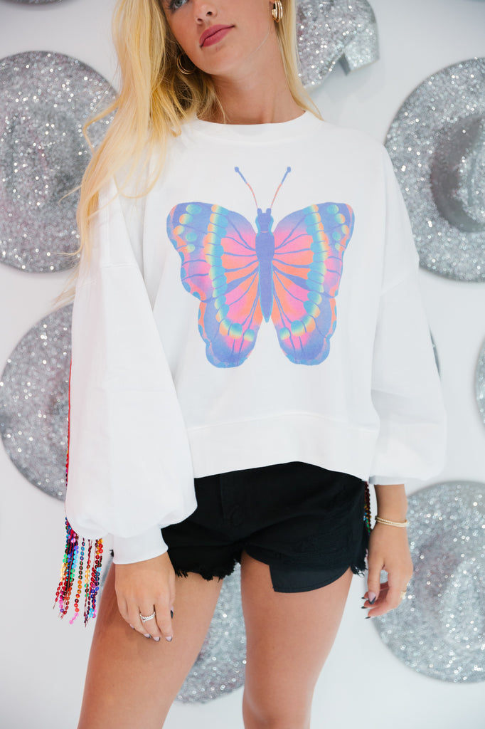 White pullover with sequin fringe and multi colored butterfly 