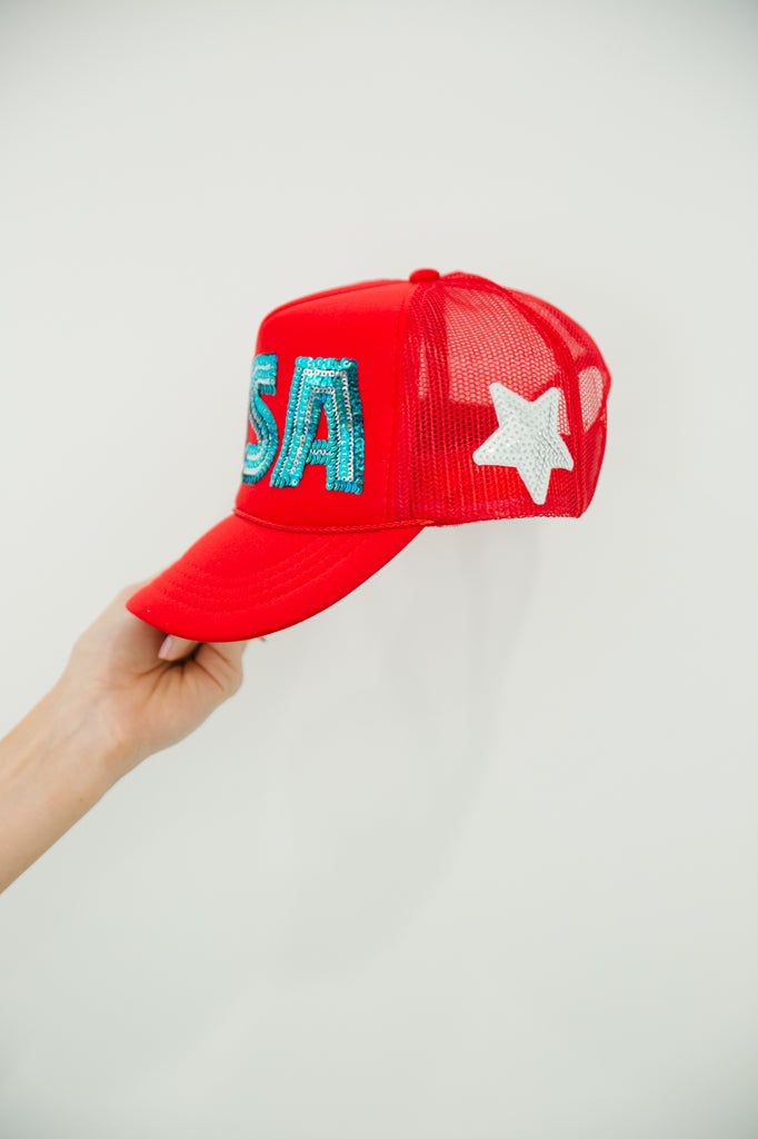 Kids red trucker hat with blue sequin "USA" letters and a white star patch