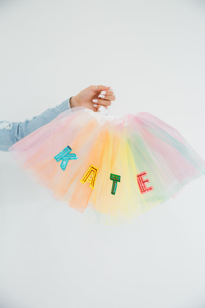 Multi colored tutu with your name customized in sequin lettering. 