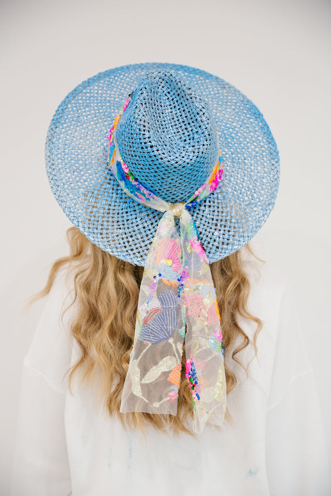 Blue straw hat with colorful sequin patterned tie band