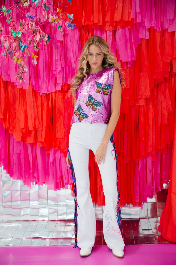 White flares with multi colored sequin fringe down the leg
