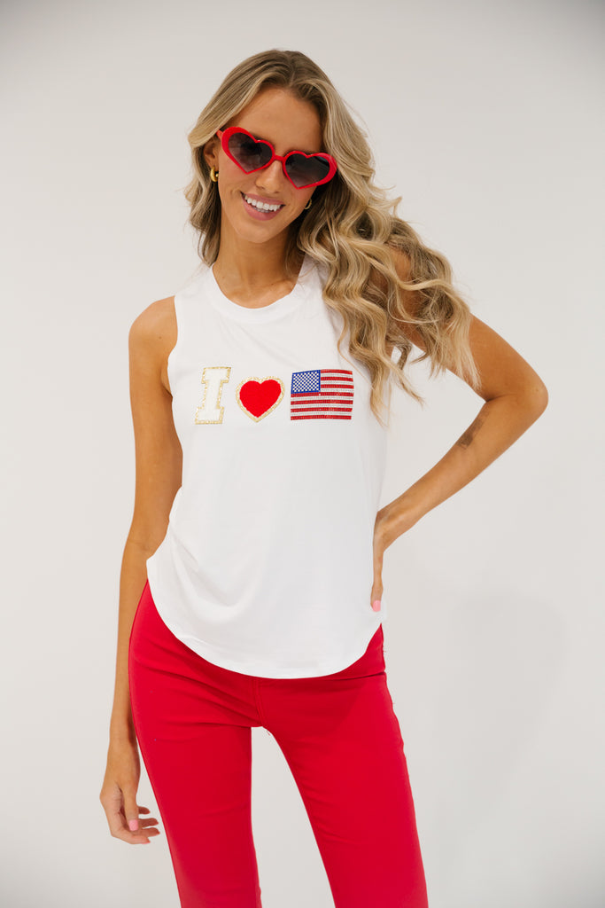 White scoop-neck tank top with a white "I", red heart, and American flag patch