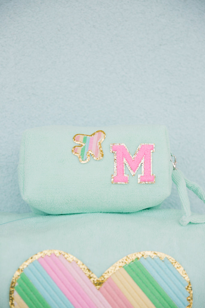 Teal terry cloth bag with custom lettering and patch of your choice. 