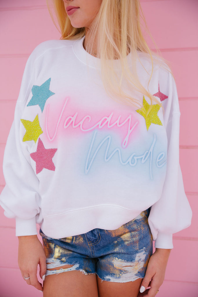 White cropped pullover with Vacay Mode in a neon print and colorful resin stars