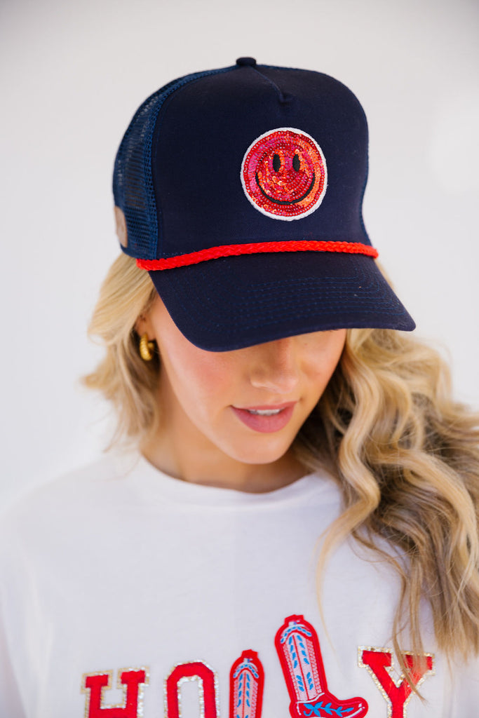 RED SMILEY ON NAVY TRUCKER HAT