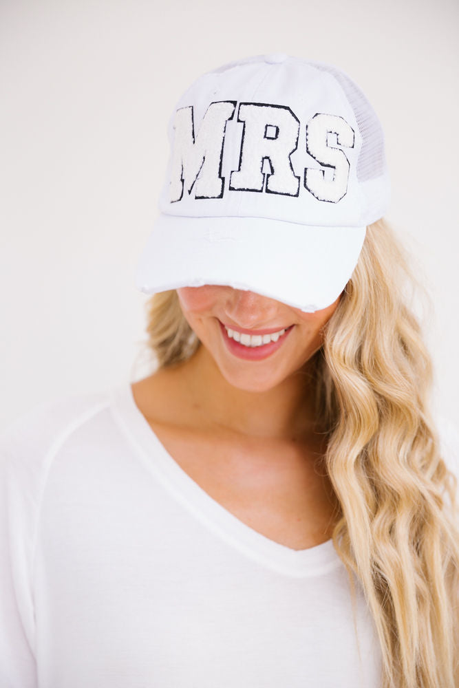 White distressed baseball hat with white varsity "mrs" letters