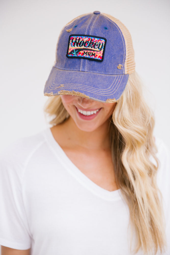 Denim distressed hat with "hockey mom" patch. 