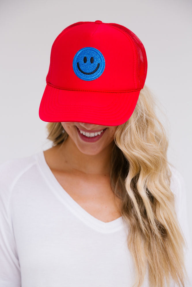 BLUE SMILEY PATCH RED HAT Hats Judith March RED TRUCKER  