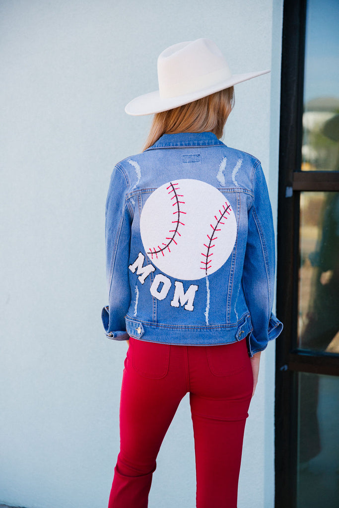 Denim jacket with big baseball patch and Mom in small white varsity letters