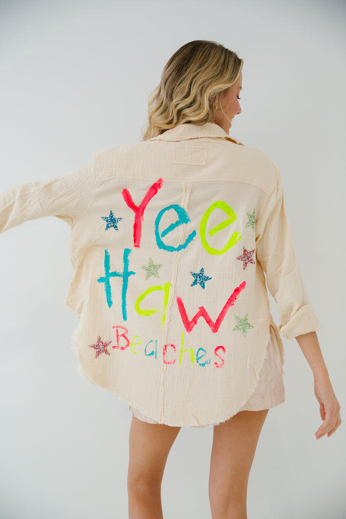 Tan button down with Yee Haw Beaches painted on the back with confetti stars