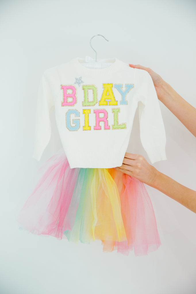 Kids white sweater with "bday girl" in colorful mini terry lettering and a silver rhinestone heart. 