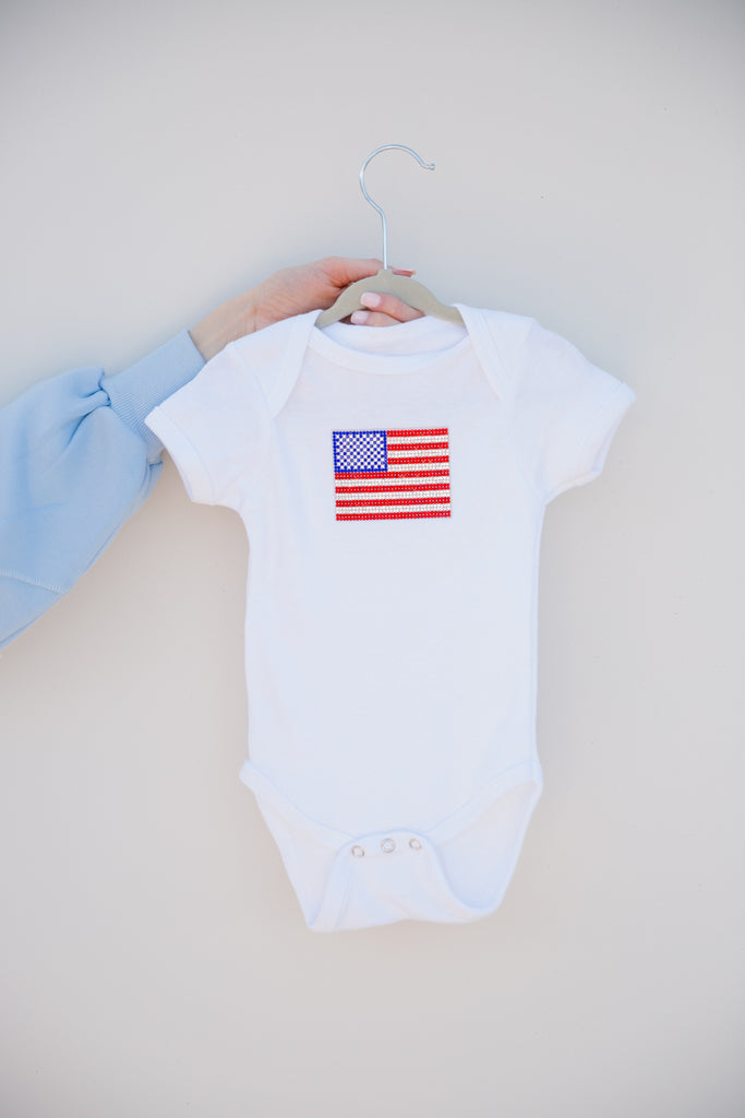 White onesie with an American flag