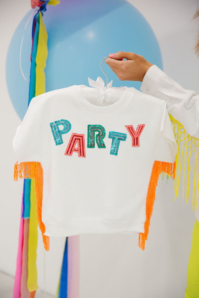 Kid white tee with orange fringe and Party in rainbow sequin letters